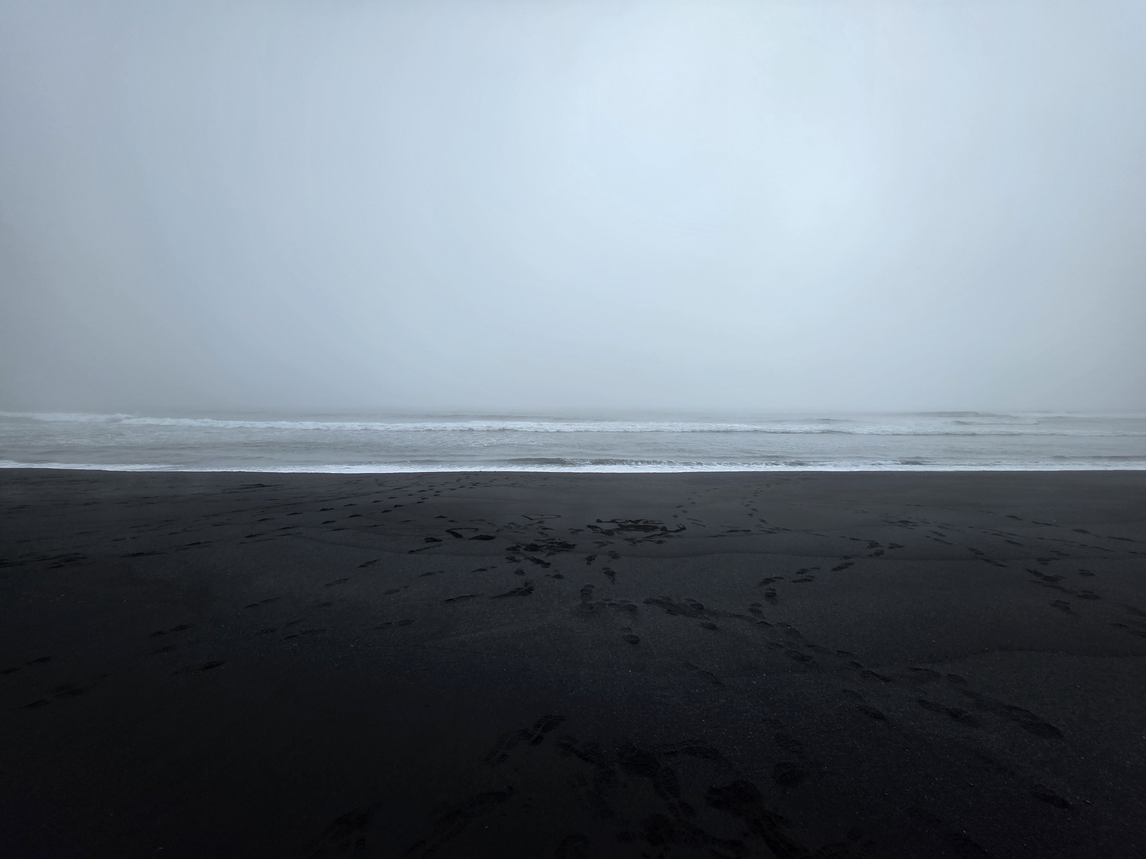 Misty black sand beach
